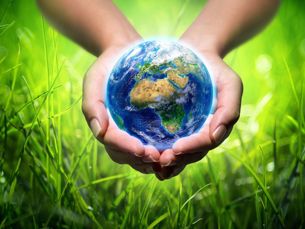 We care about the environment- hands holding the world